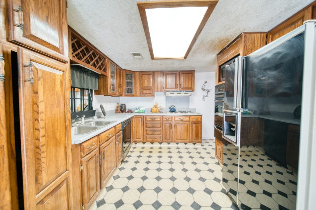 A kitchen with a black and white checkered floor