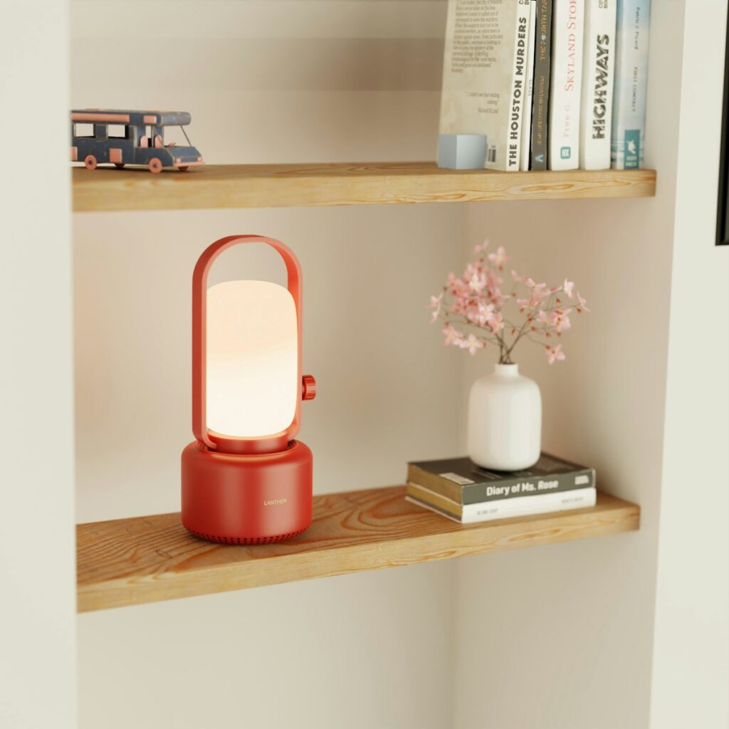 A shelf with some books and a lamp on it
